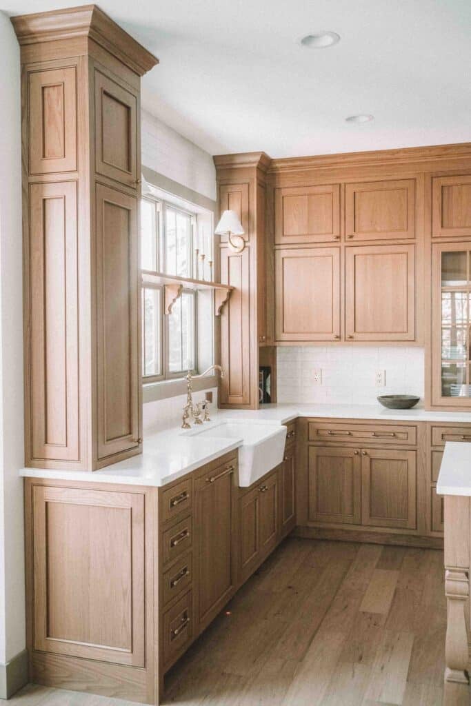 white oak inset cabinets with molding panel ready dishwasher