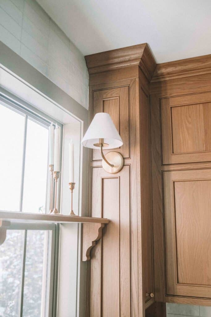 sconces on cabinets custom kitchen with a shelf over the window