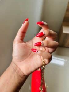 Red short stiletto nails with little diamonds